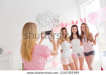 Photo of sweet funny young ladies nightwear headbands hugging tacking photo indoors house room