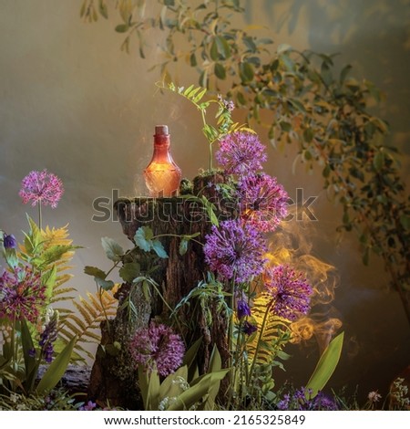 bottle of magic potions in  magical forest Royalty-Free Stock Photo #2165325849