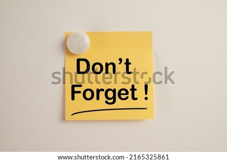 Don't Forget word on yellow stickynote on whiteboard use for meeting,reminder,notepaper,word graphic concept.