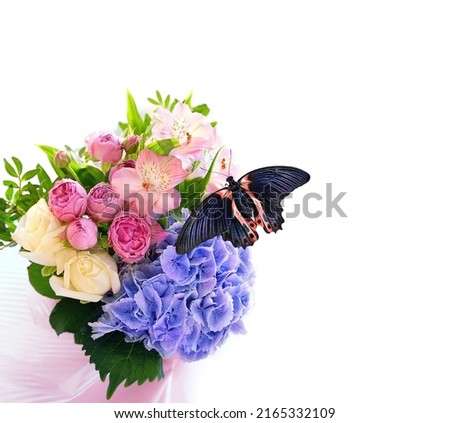 gentle beautiful bouquet with flowers and tropical butterfly close up on white abstract background. romantic floral festive image. Hyacinth, eustoma, roses flowers. template for design. copy space