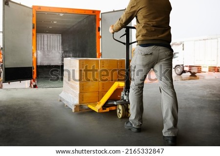 Workers Unloading Packaging Boxes on Pallets into The Cargo Container Trucks. Loading Dock. Shipping Warehouse. Delivery. Shipment Goods. Supply Chain. Warehouse Logistics Cargo Transport.	
 Royalty-Free Stock Photo #2165332847