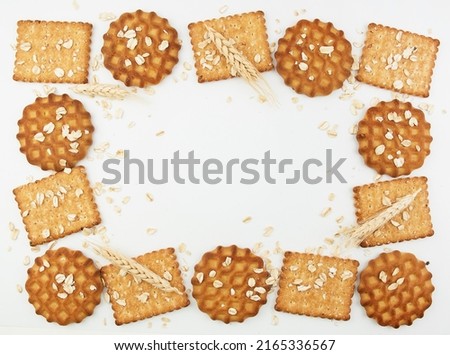 Healthy and delicious cookies and crackers. Oats and wheat on the background. copy space frame for recipes with spikelets