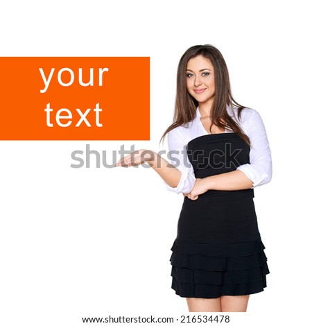 portrait of young smiling woman showing open hand palm with copy space for product or text