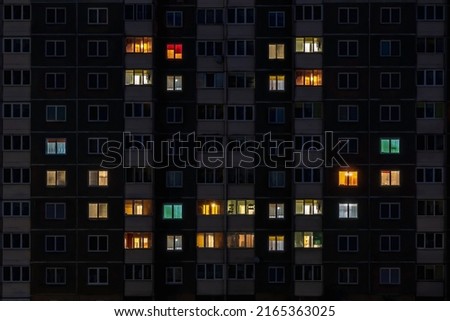 flat night panorama of multicolor smile face light in windows of multistory buildings Royalty-Free Stock Photo #2165363025