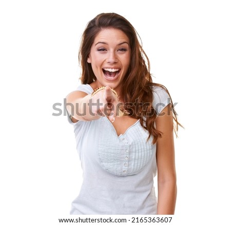 Genuine laughter. A gorgeous young woman laughing and pointing at the camera. Royalty-Free Stock Photo #2165363607