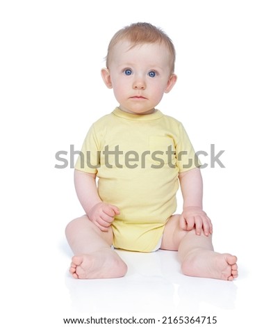 He finds you very interesting. A cute baby boy against a white background.