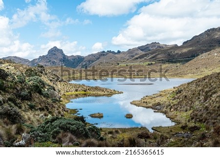 Cajas National Park on sunny day. Mountain lake Apicocha and  mountain Avilahuayco of an altitude of 4185m above sea level. South America, Ecuador, Azuay province close to Cuenca