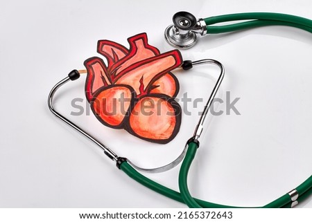 Realistic drawn red heart and stethoscope on white background. Healthcare and medical treatment concept.