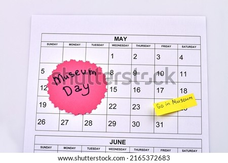 Paper may calendar and international museum day concept. Isolated on white background.
