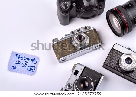 Photography day concept. Collection of retro photo cameras. Isolated on white background.