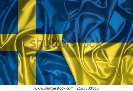 Sweden and Ukraine folded silk flag together