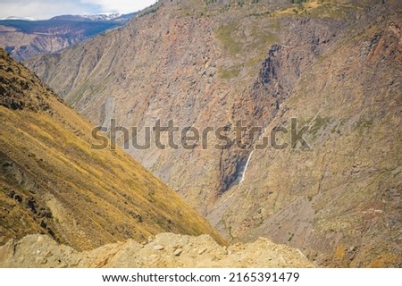 View from Mountain pass Katu-Yaryk of waterfall, which falls from a cliff in, Altai, Russia. High quality photo