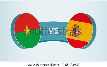 Burkina Faso versus Spain, team sports competition concept. Round flag of countries.