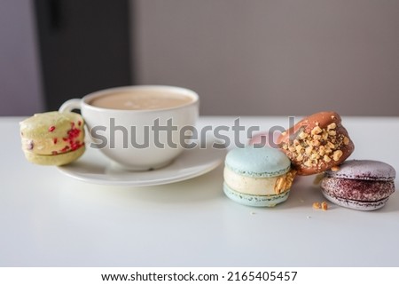 Morning coffee with macaroons in a cafe, good morning