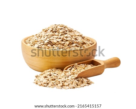 Dry raw cereal oatmeal  in wooden scoop and bowl isolated on white background. Royalty-Free Stock Photo #2165415157