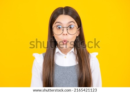 Studio shot of emotional adorable little girl surprised and shocked, showing true astonished reaction on unexpected news. Funny teenager child girl face.