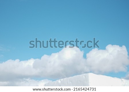 Ice cube snow with clouds and blue sky.