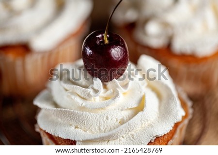 delicious cupcake with a natural cherry selective focus