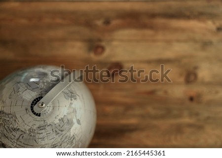 A studio photo of a desktop spinning globe
