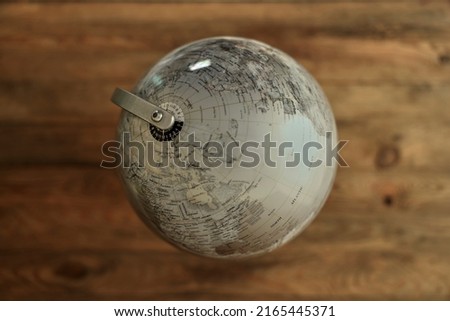 A studio photo of a desktop spinning globe