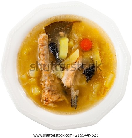 Fresh fish stock made of salmon carcass. Fish offal dish. Isolated over white background
