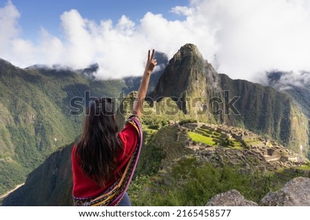 woman on her back enjoying her arrival at machu picchu Royalty-Free Stock Photo #2165458577