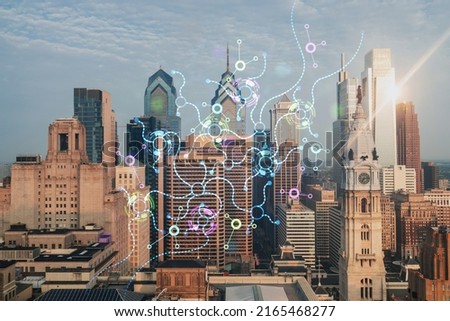 Aerial skyline of Philadelphia financial downtown, Pennsylvania, USA. City Hall Clock Tower, sunrise. Hologram of Artificial Intelligence concept. AI, machine learning, neural network, robotics