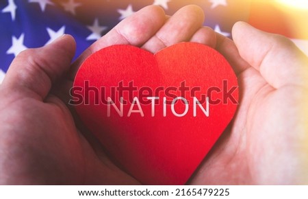 Love for America. Heart on the background of the USA flag. Patriotism and love. The heart of the country.