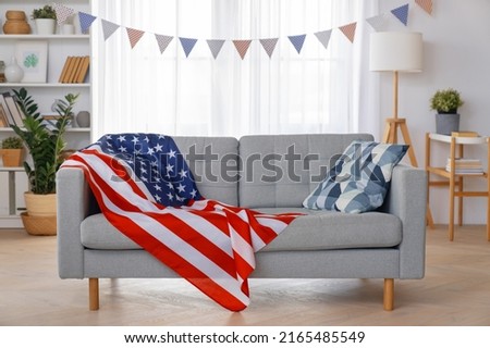 Patriotic holiday. The USA are celebrating 4th of July. American flag in the room. Royalty-Free Stock Photo #2165485549