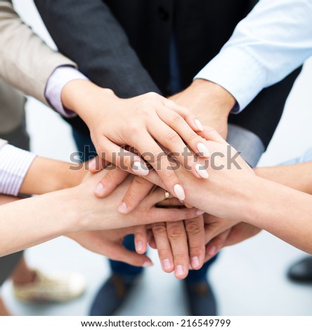 Businesspeople Stacking Hands Royalty-Free Stock Photo #216549799