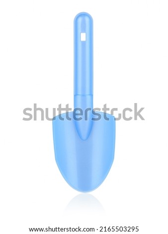 Children's blue shoulder blade. A shovel for playing with sand. Shoulder blade on a white background. The concept of the construction. Royalty-Free Stock Photo #2165503295