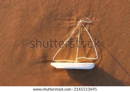 Top view image of small wooden boat on beach at summer