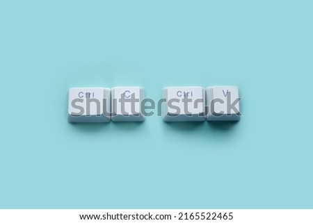 Ctrl C, Ctrl V keyboard buttons, copy and paste key shortcut isolated on a blue background. Royalty-Free Stock Photo #2165522465