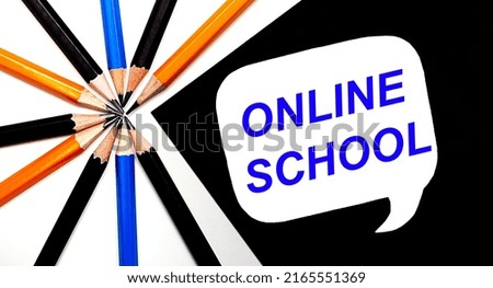 On a light background, multi-colored pencils and on a black background a white card with the text ONLINE SCHOOL