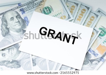 Office table with a white card with text GRANT.