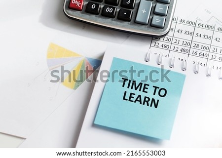 A card on the table with text Time To Learn