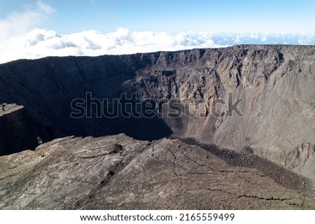 Aerial view by drone of the Piton de la Fournaise, the Dolomieu crater, the Formica Léo volcanic cone and the Chapelle de Rosemont in the Fouqué enclosure, Reunion Island