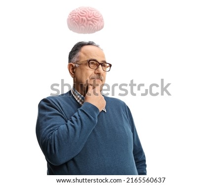 Pensive mature man standing and thinking with a human brain above his head isolated on white background Royalty-Free Stock Photo #2165560637