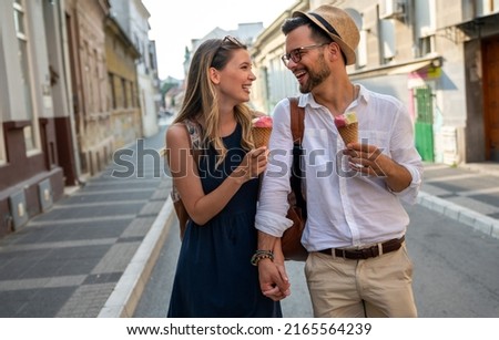 Portrait of happy couple having fun on vacation. People travel happiness concept.