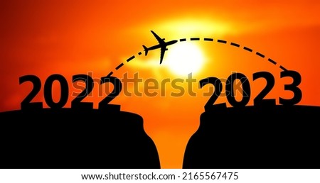Happy new year concept, Airplane moving towards 2023 from 2022