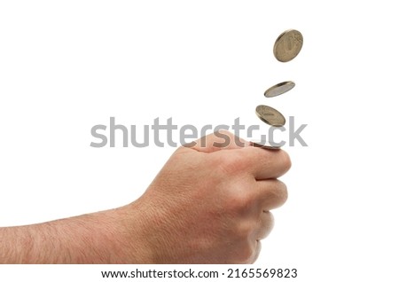 Making choice: hand throwing up a coin, isolated on white background with clipping path. Royalty-Free Stock Photo #2165569823