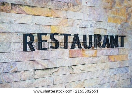Restaurant letter sign with raised letters not attached to the wall.