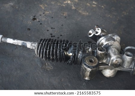 Close-up of cracked , broken power steering rack rubber boot. Royalty-Free Stock Photo #2165583575