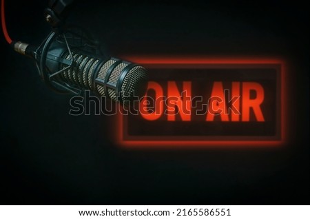 Professional microphone and on air sign background Royalty-Free Stock Photo #2165586551