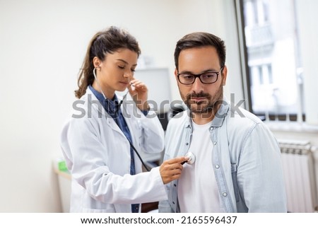 Caring Caucasian female doctor use phonendoscope examine male patient heart rate at consultation in hospital. Woman nurse or GP use stethoscope listen to man heartbeat in clinic.