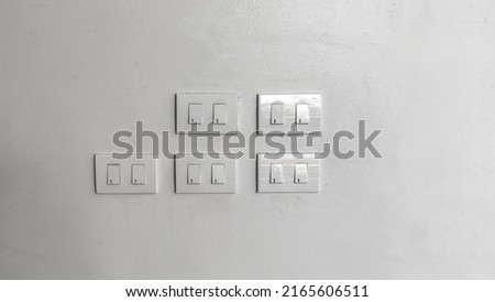white light switch on white wall