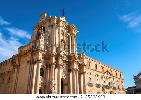 Scenic view on facade of Duomo Cathedral of Ortigia (Ortygia) in Syracuse (Siracusa), Sicily, Italy, Europe. Historic city center of Piazza del Duomo, UNESCO World Heritage Site. Mediterranean flair Royalty-Free Stock Photo #2165608699