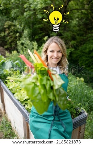 pretty young woman with green apron works in garden and has drawn light bulb over her head