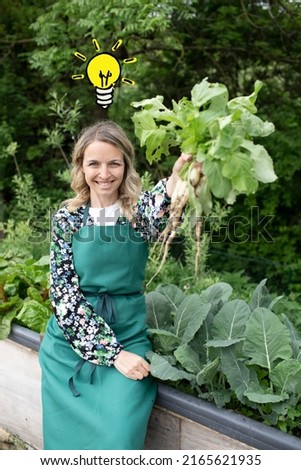 pretty young woman with green apron works in garden and has drawn light bulb over her head
