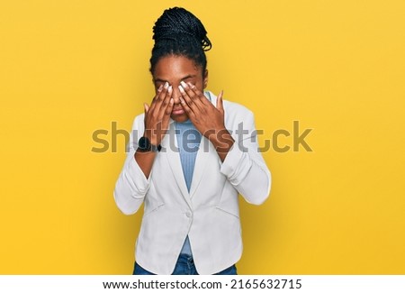 Young african american woman wearing business clothes rubbing eyes for fatigue and headache, sleepy and tired expression. vision problem 